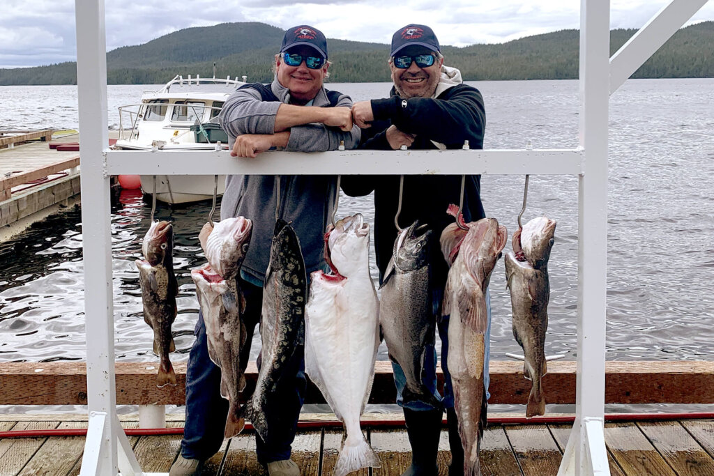 Guests showing off catch at Salmon Falls Resort