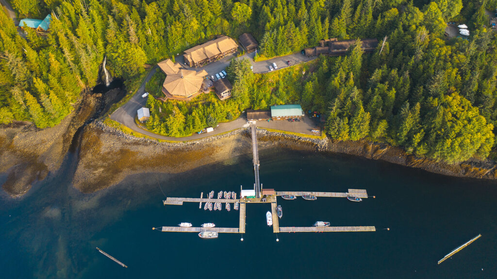Aerial photograph showcasing Salmon Falls Resort's location amidst lush greenery and overlooking the water. Courtesy Salmon Falls Resort website.