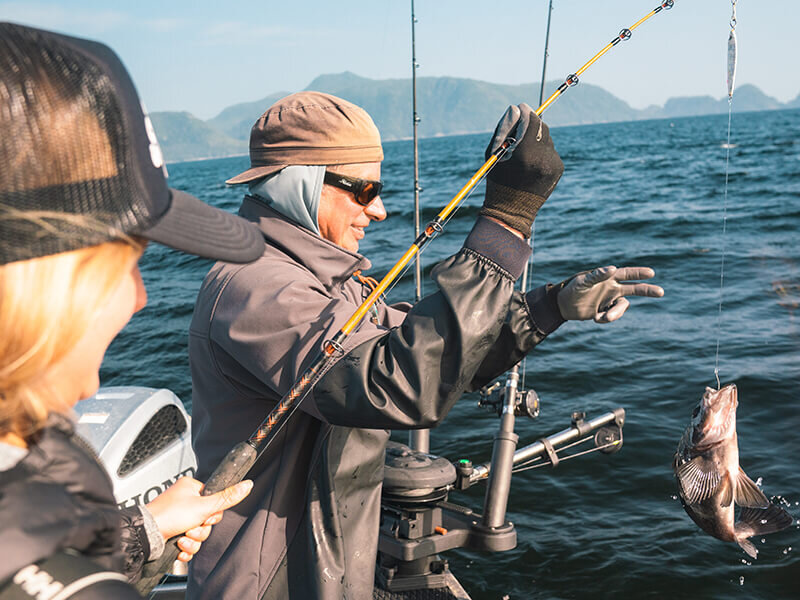 Captain Mike Bunker reeling in fish