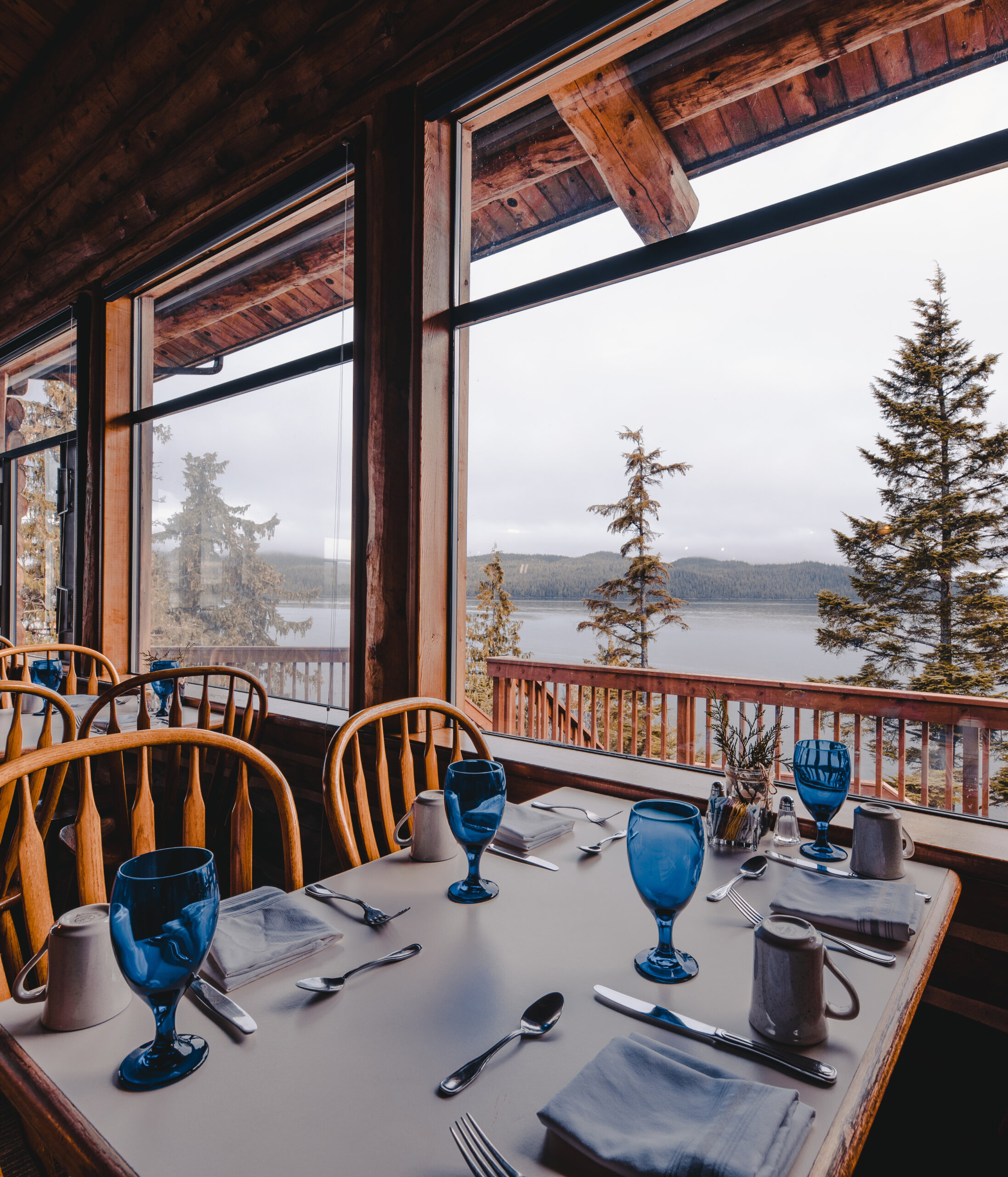 Seating with a view of the water at Timbers Restaurant at Salmon Falls Resort